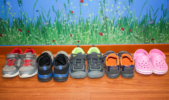 Photo of LAIPT patients' shoes lined up on the floor